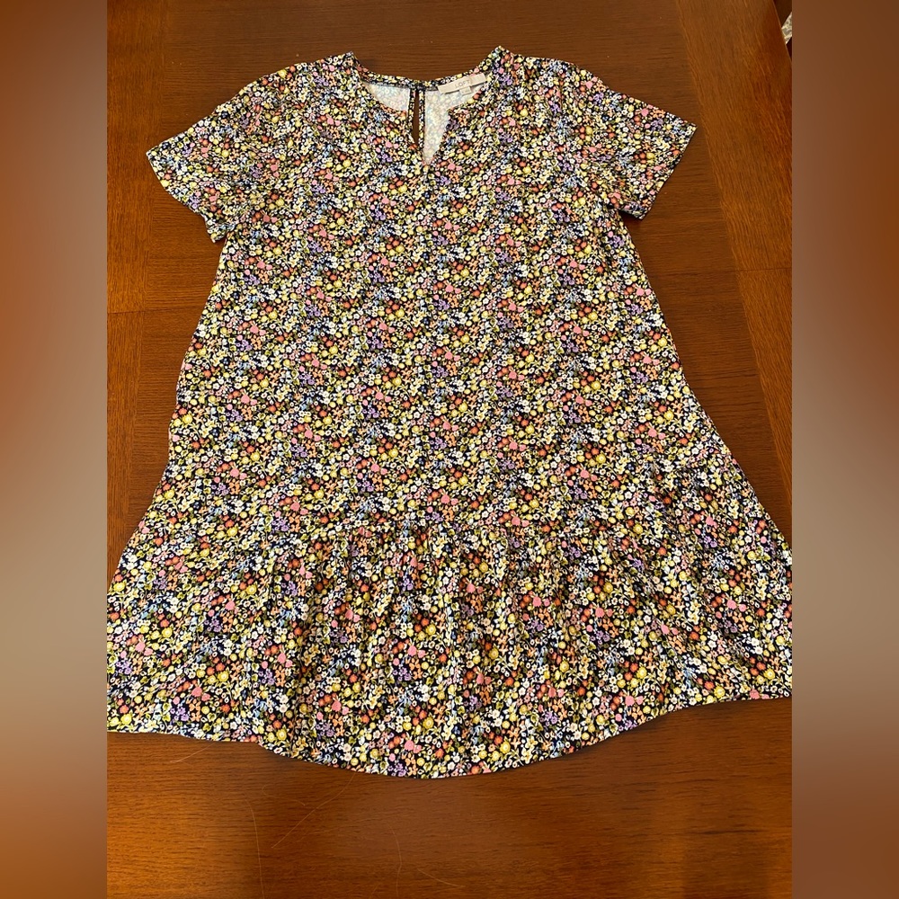 Loft medium ruffle dress. Black background with assorted colored small flowers